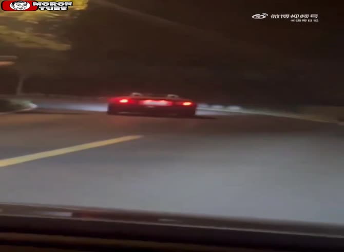 Video :A woman in a convertible collides with a bike while racing up a mountain